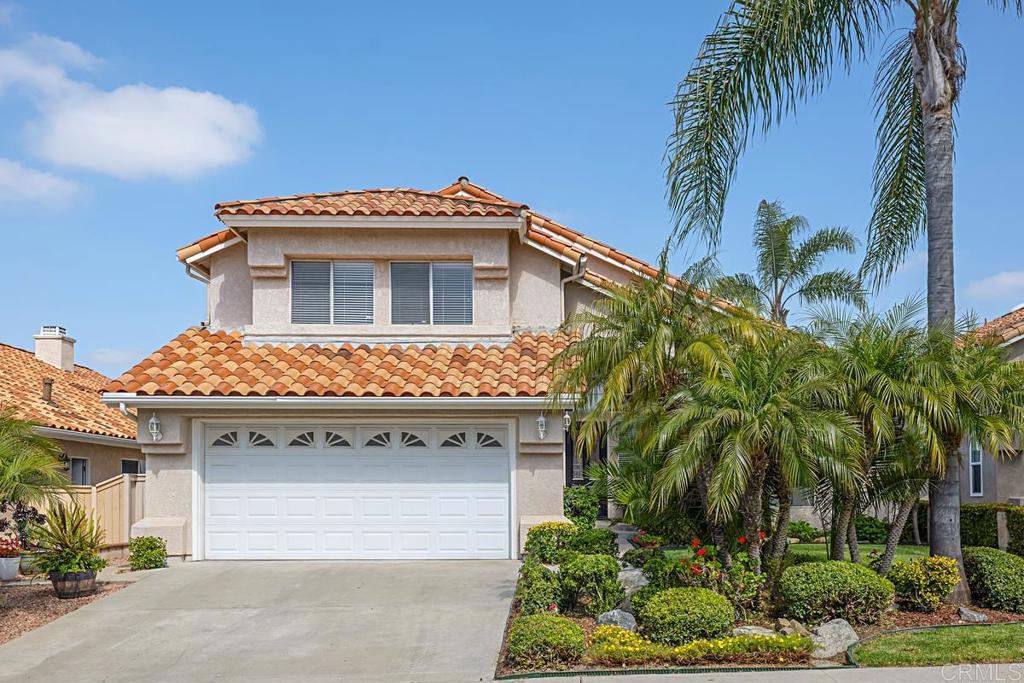 a front view of a house with a garage