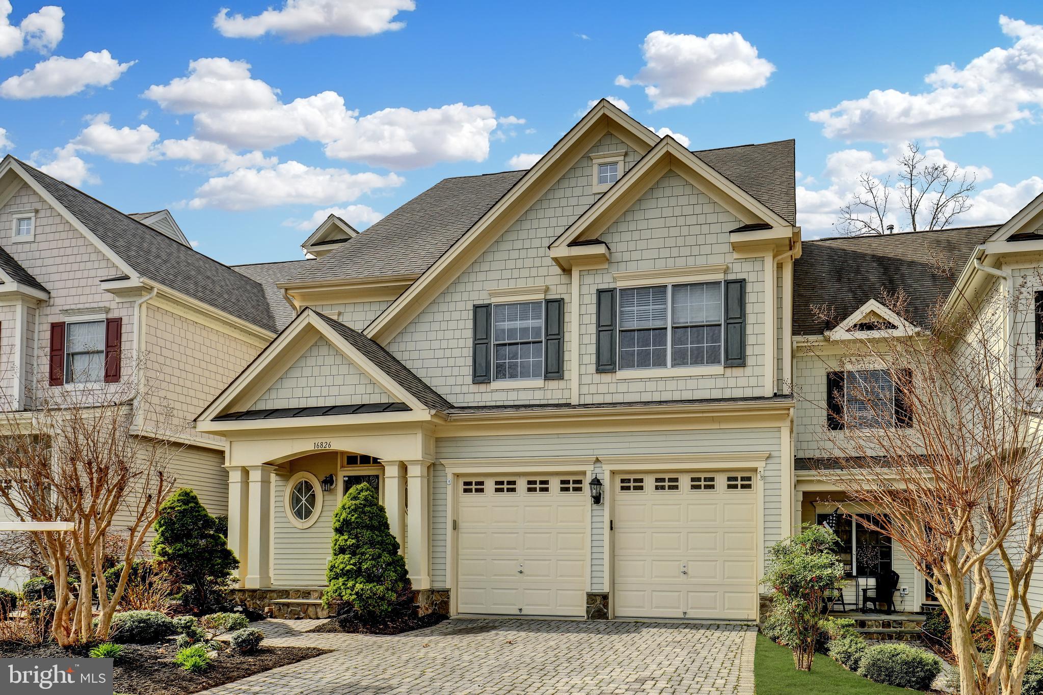 a front view of a house with garage