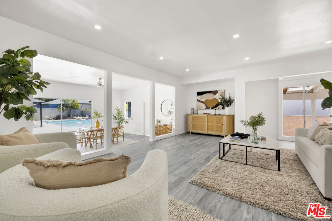 a living room with furniture and a table