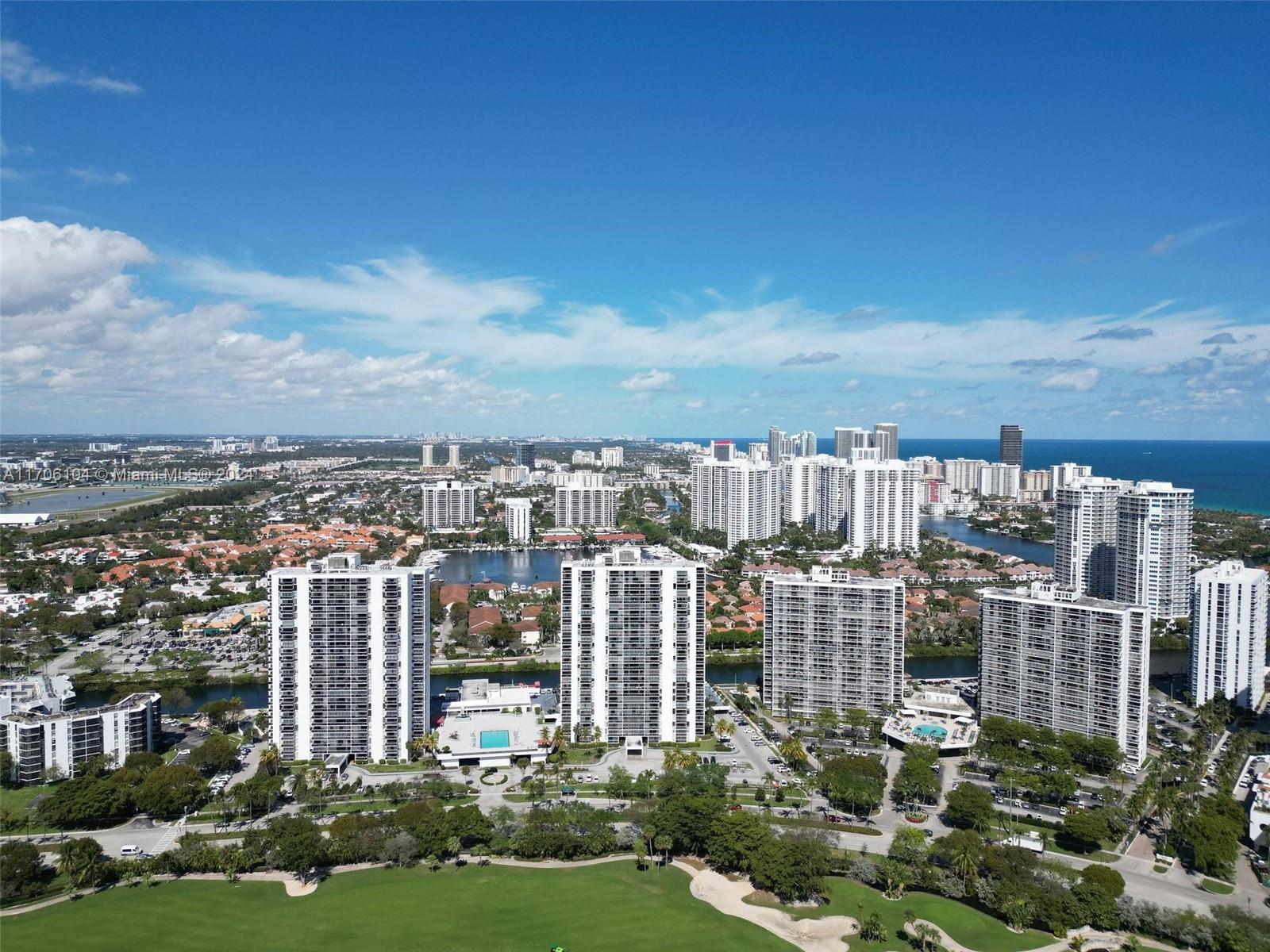 a view of a city with tall buildings in front of it