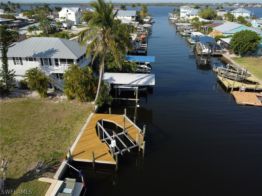 an aerial view of houses with yard