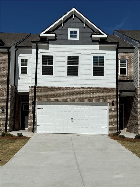 a front view of a house with a garage