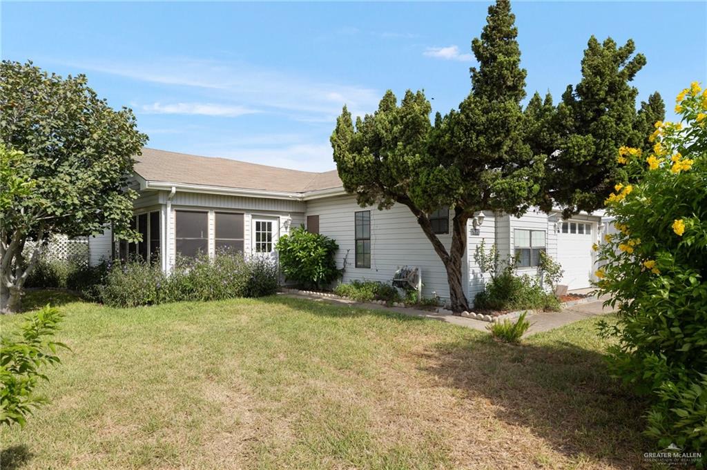 a view of a house with a yard