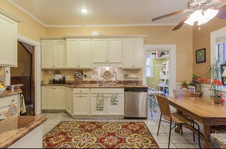 a kitchen with a stove a sink and a refrigerator