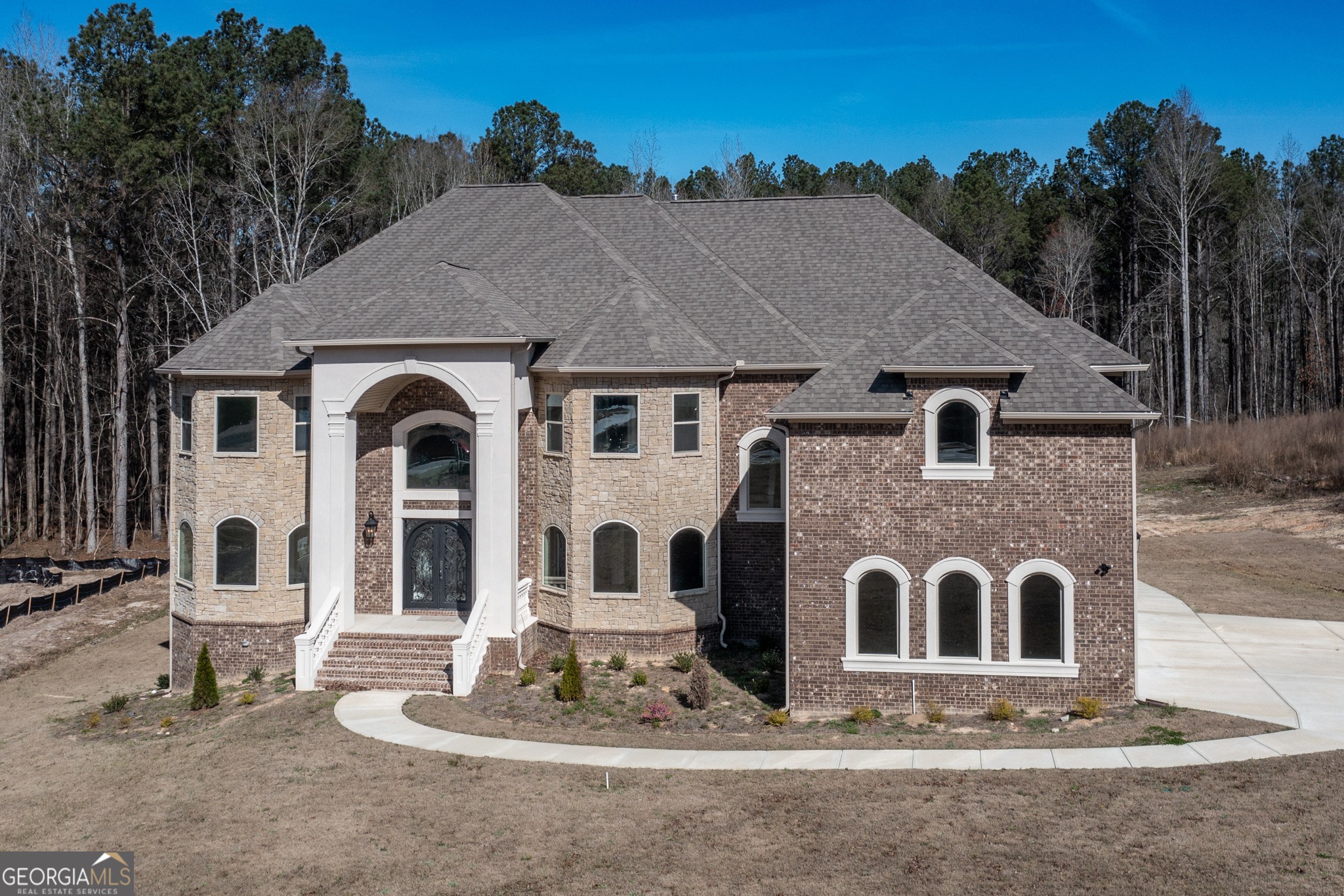 a front view of a house with a yard