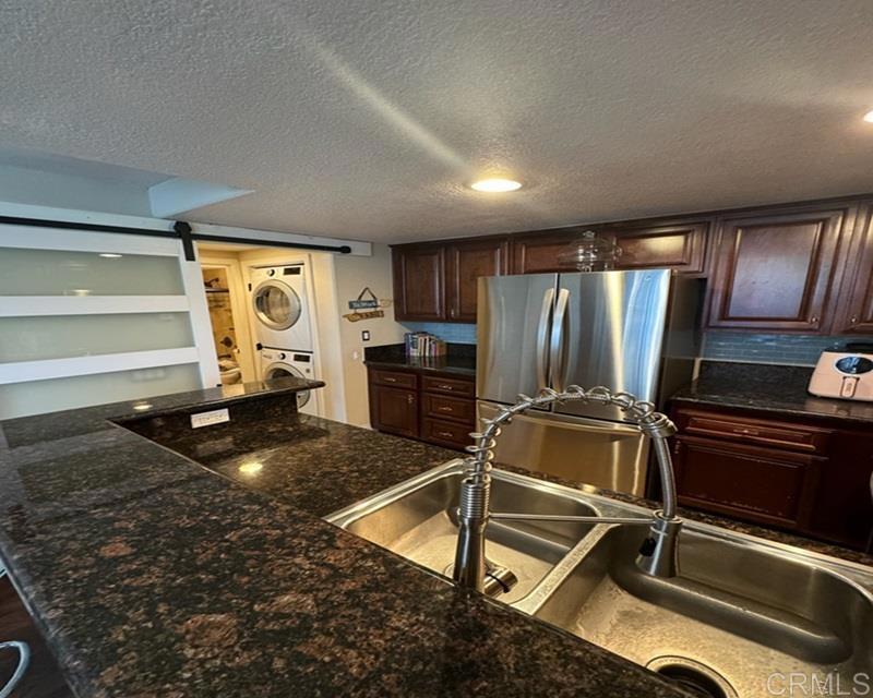 a kitchen with kitchen island a counter top space appliances and cabinets