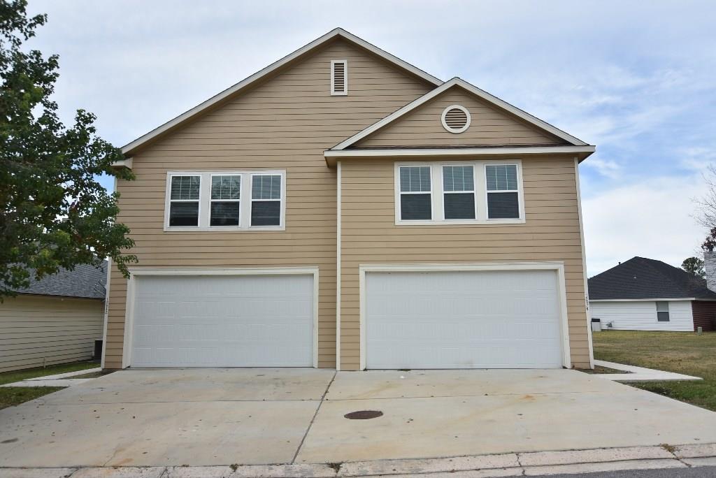 a front view of a house with a garage