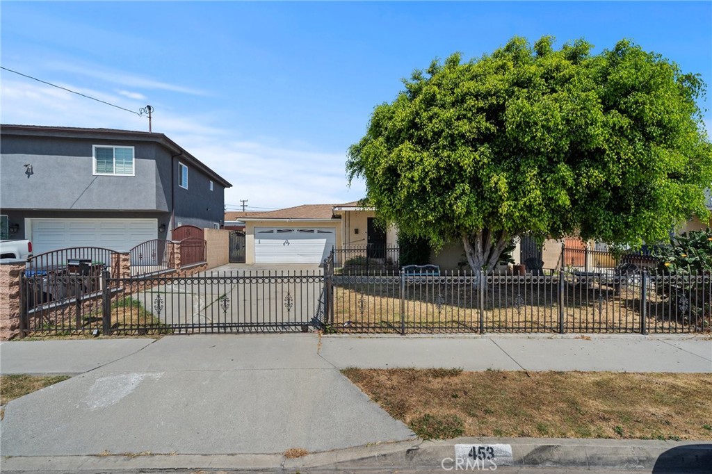 a view of house with iron fence