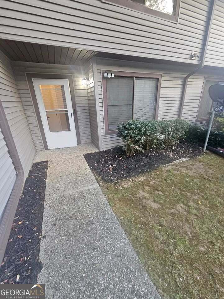 a view of a pathway both side of house