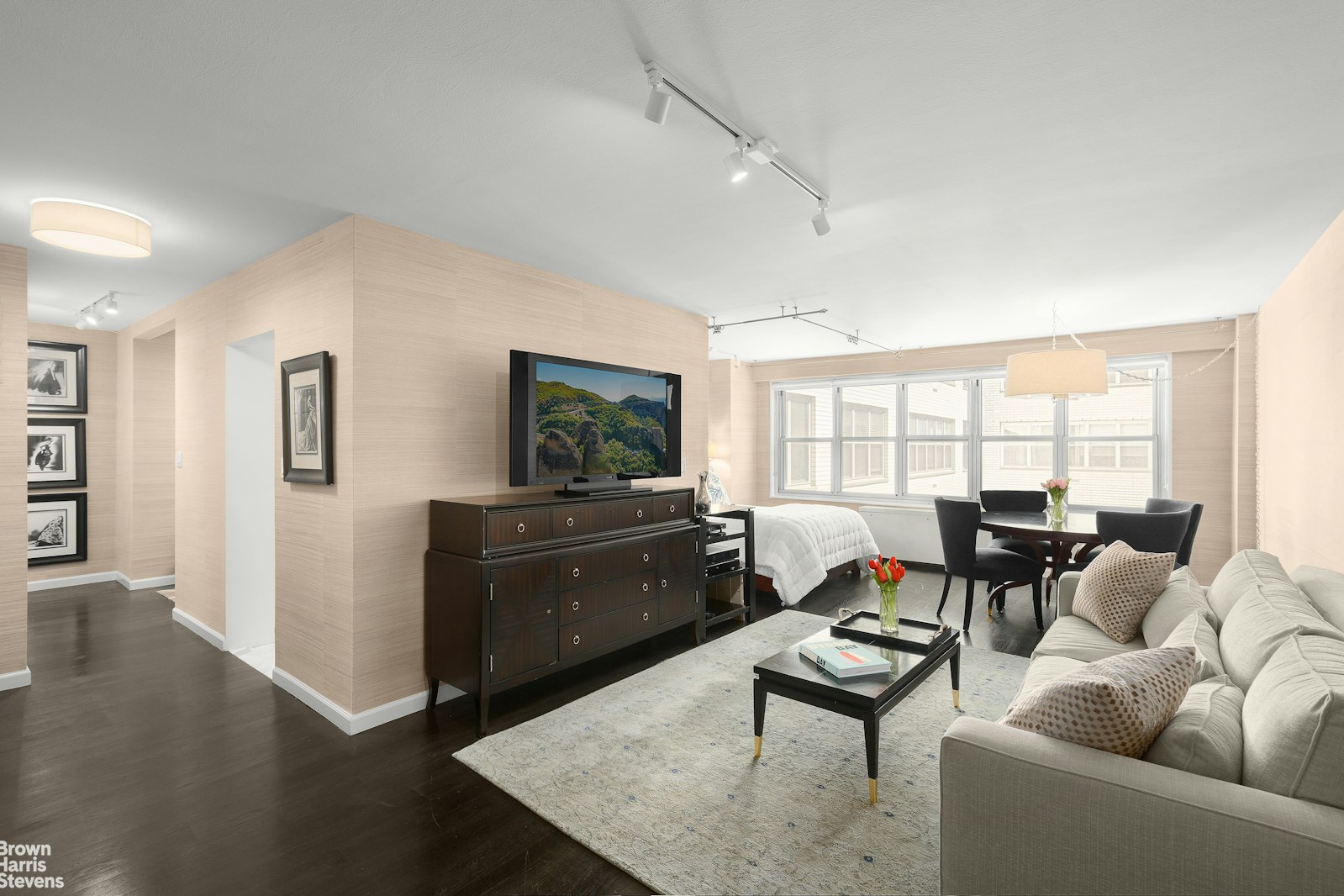 a living room with furniture and a flat screen tv