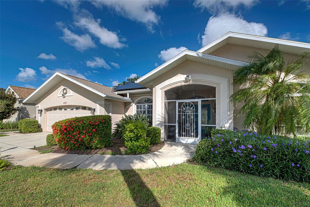 a front view of a house with garden