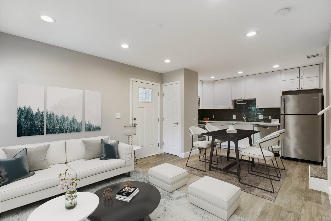 a living room with furniture and a table