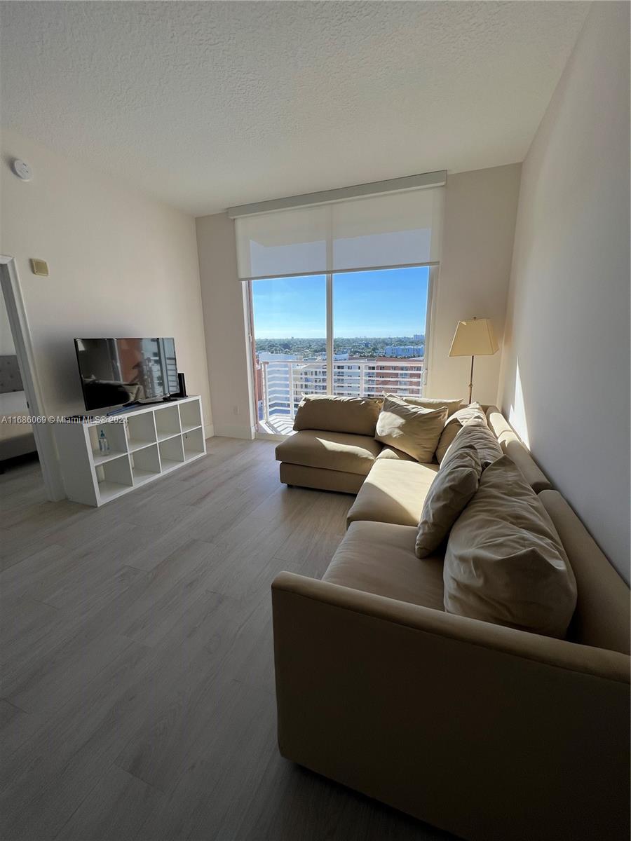 a living room with furniture and a window