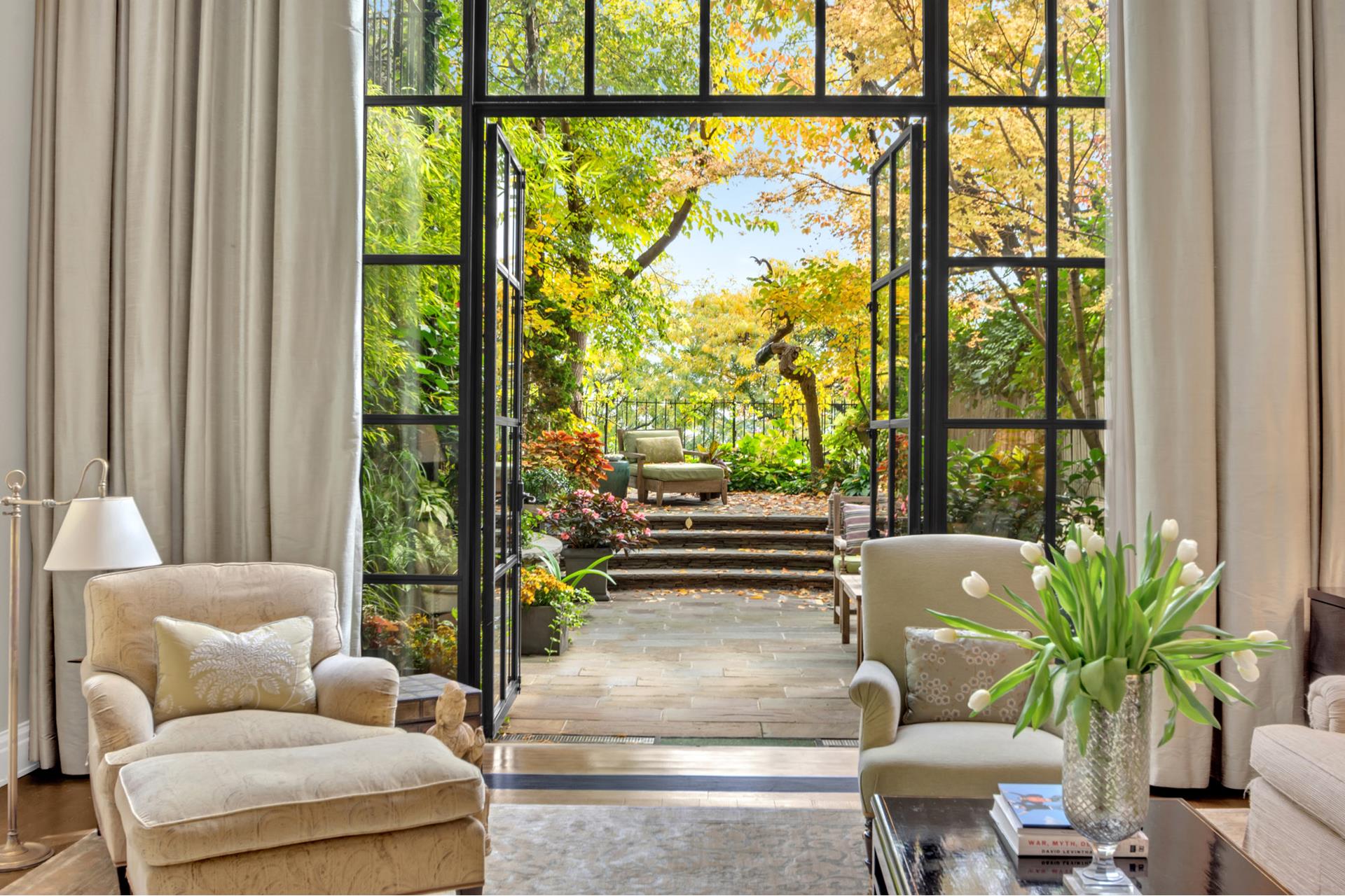 a living room with furniture and a potted plant