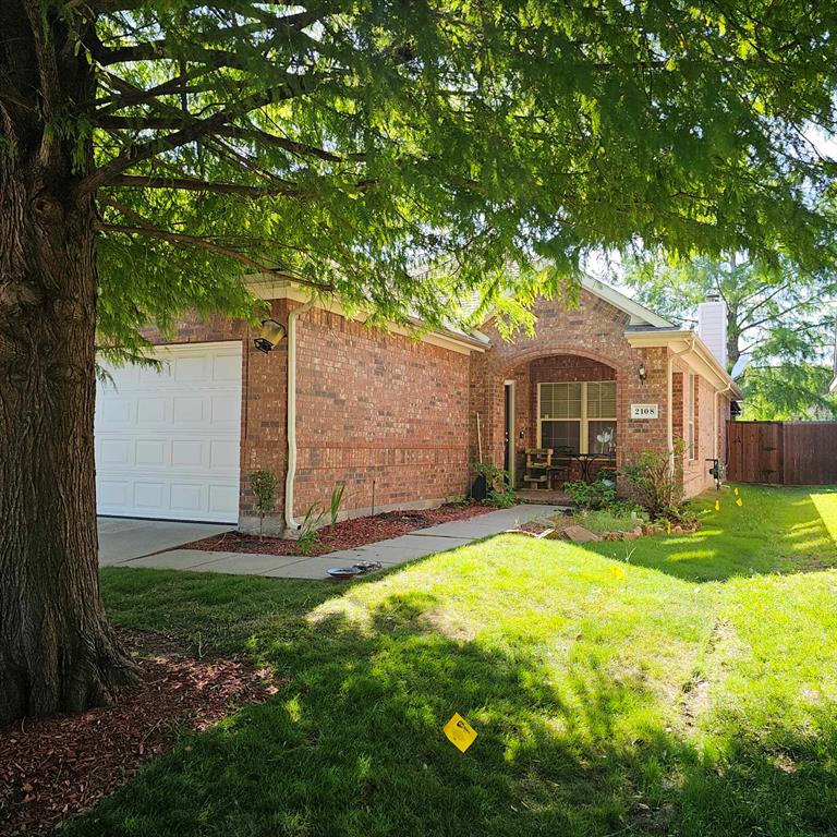 a front view of a house with yard