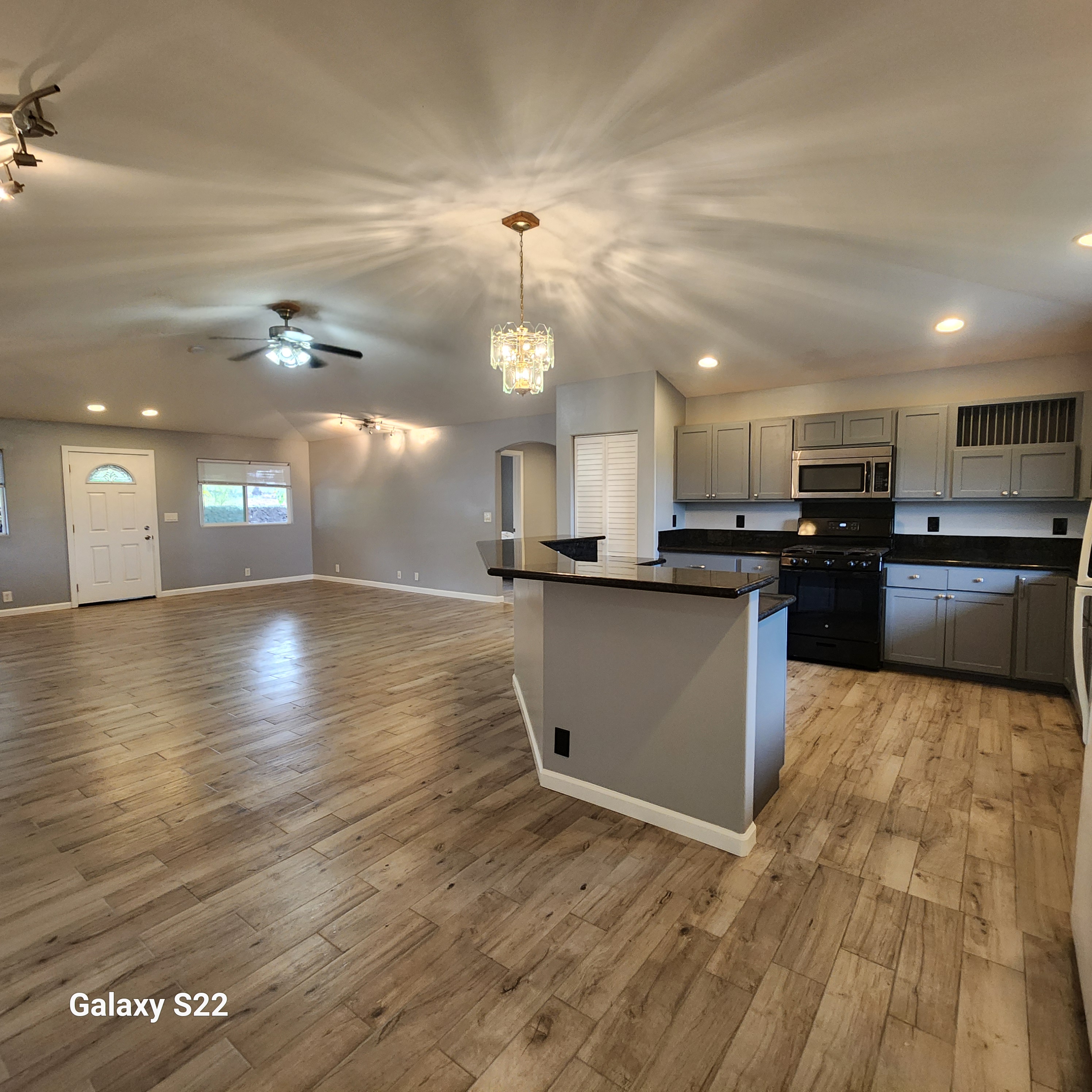 a view of kitchen with cabinets