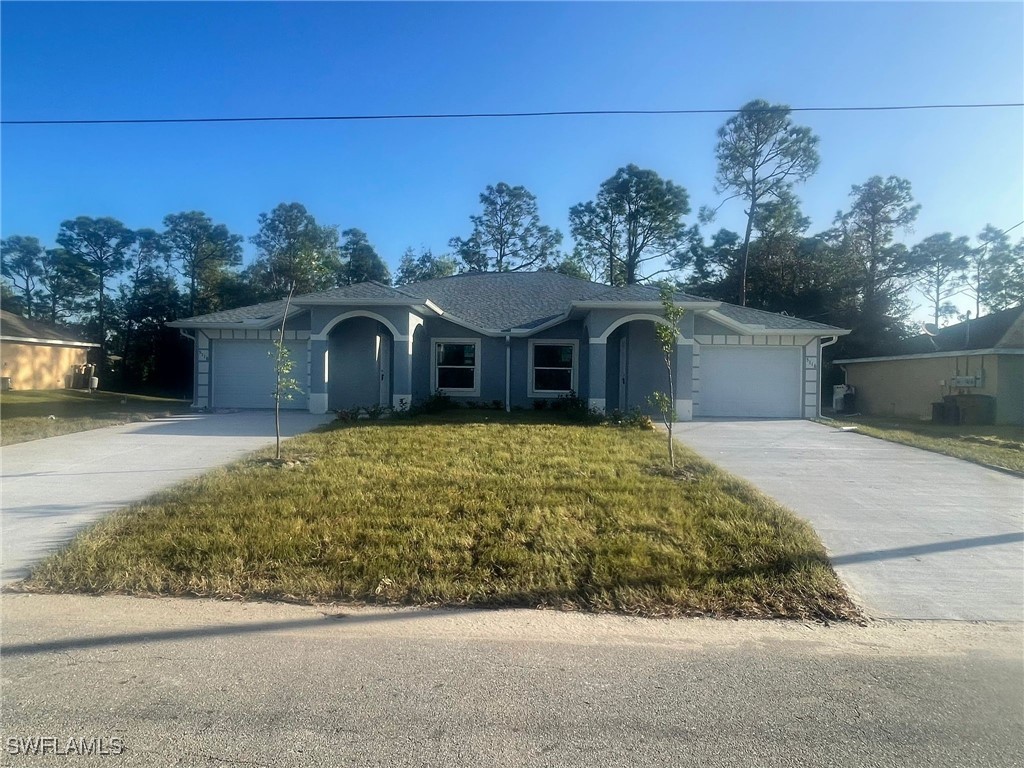 front view of a house with a garden