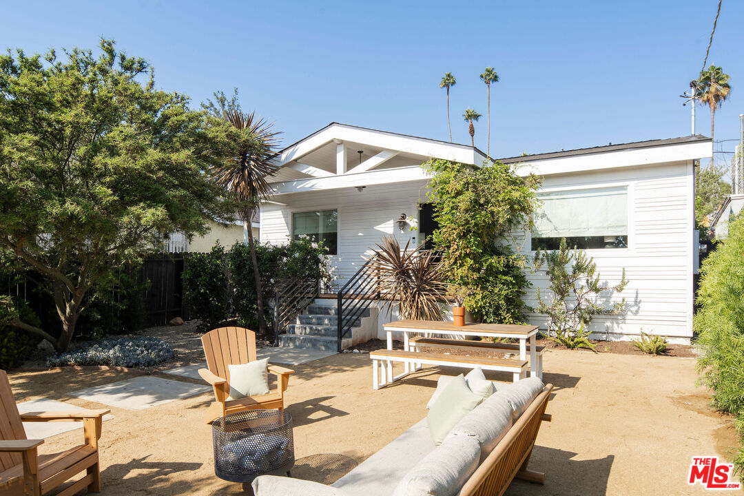 a view of outdoor kitchen and dining area