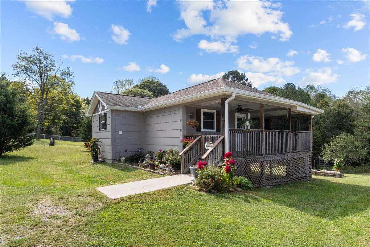 a view of an house with backyard space and garden