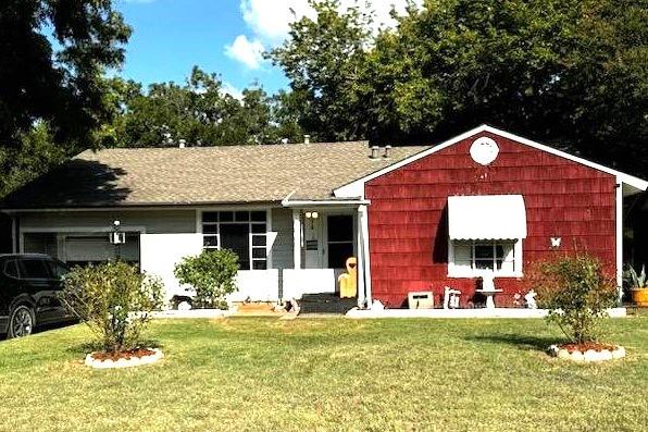 a front view of a house with garden