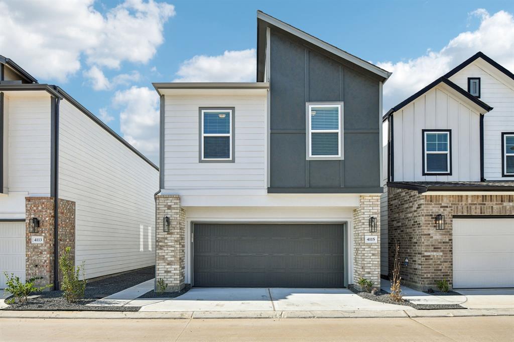 a front view of a house with garage