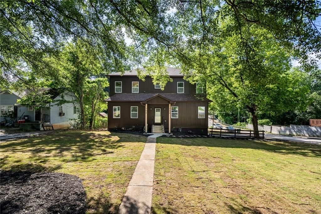 a front view of a house with a yard