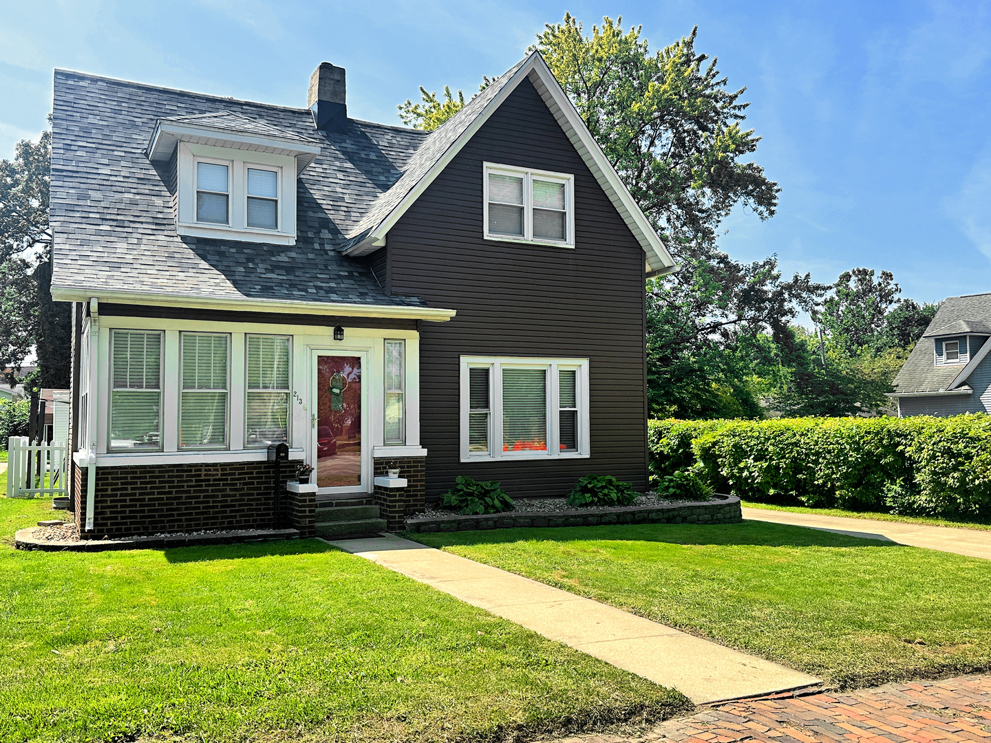 a front view of a house with a yard