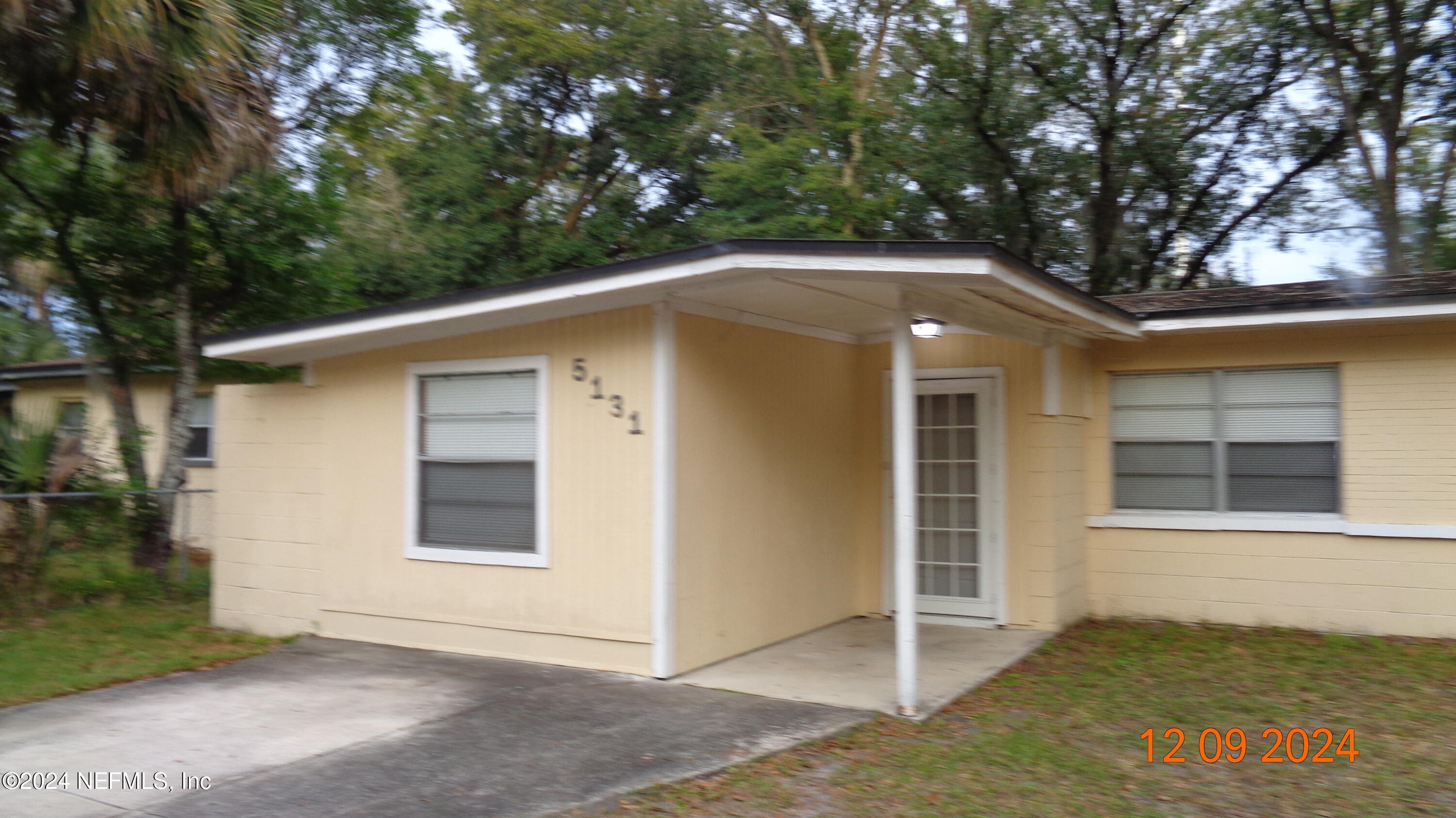 a front view of a house with a garage