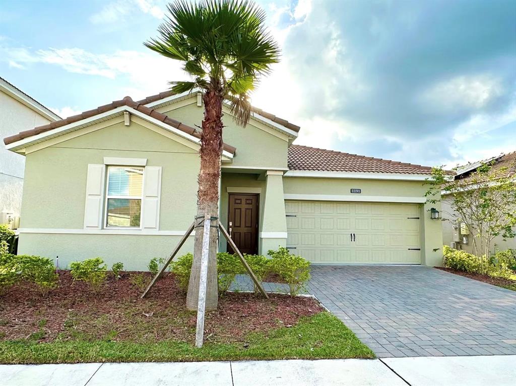 a front view of a house with a garage