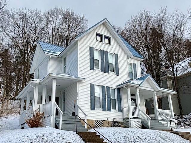 a front view of a house with large windows