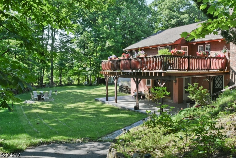 a view of a park with sitting area and garden