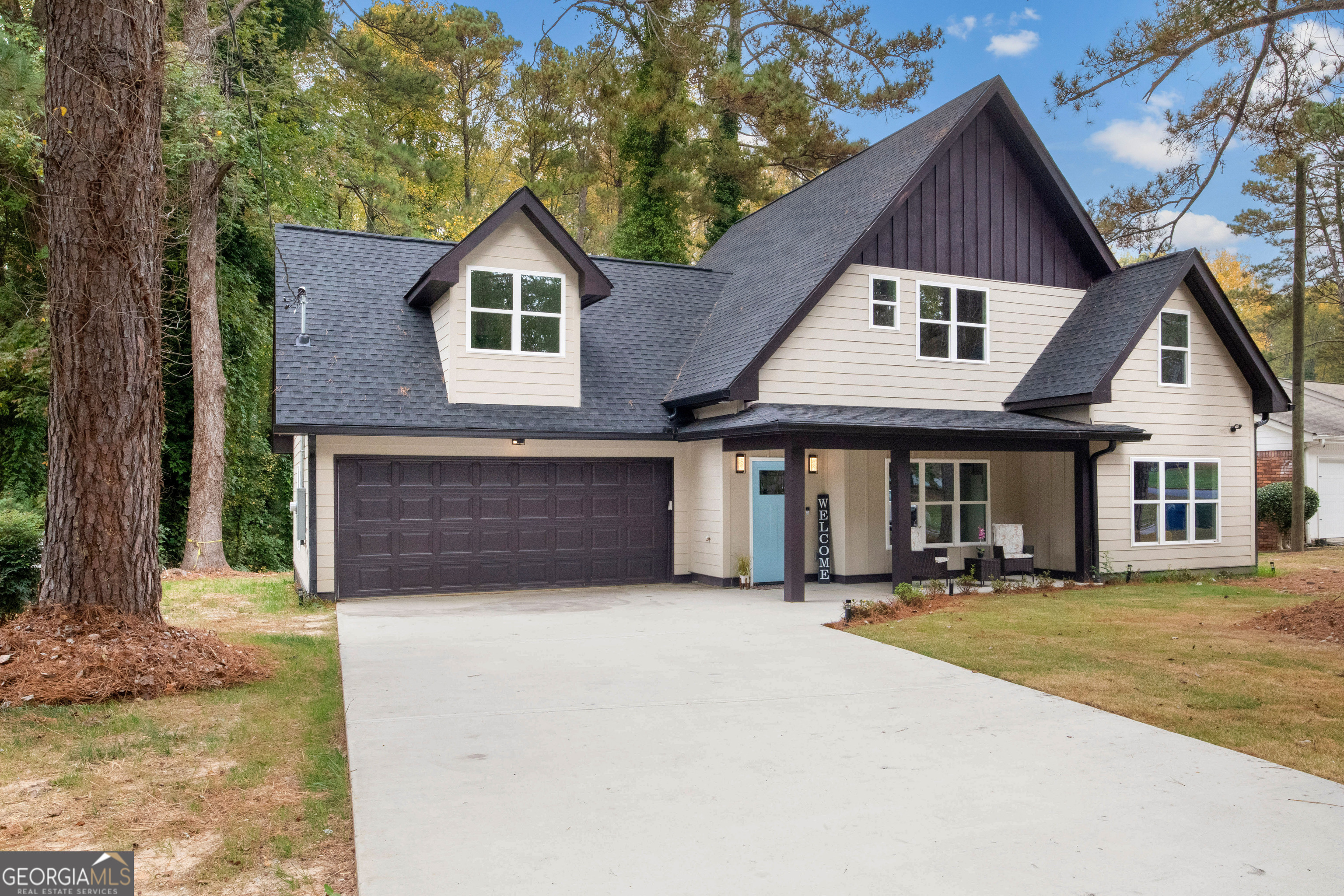 a front view of a house with a yard