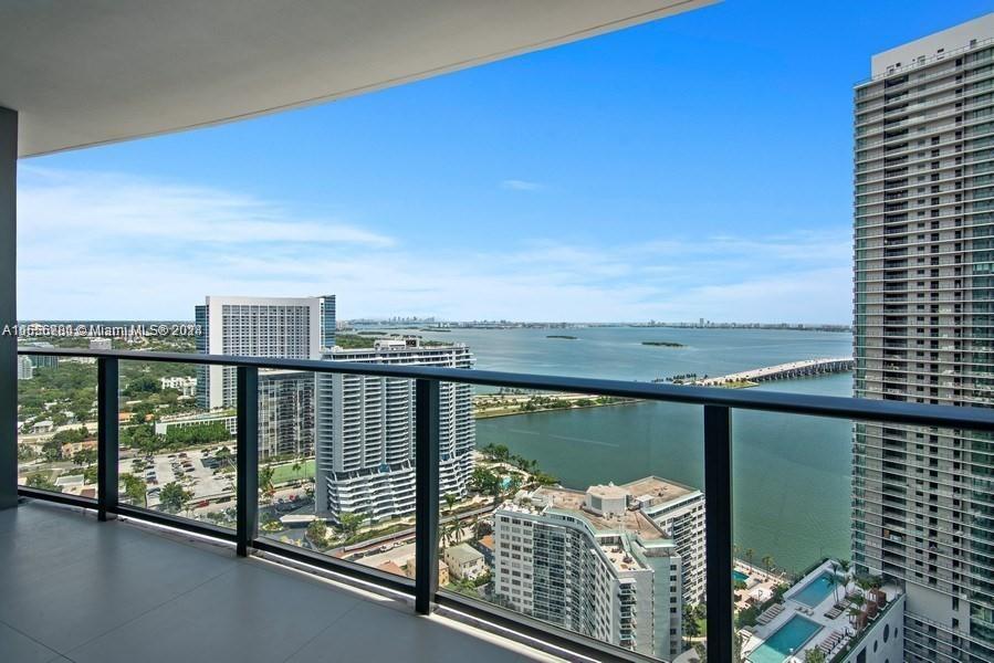 a view of a balcony with an ocean view