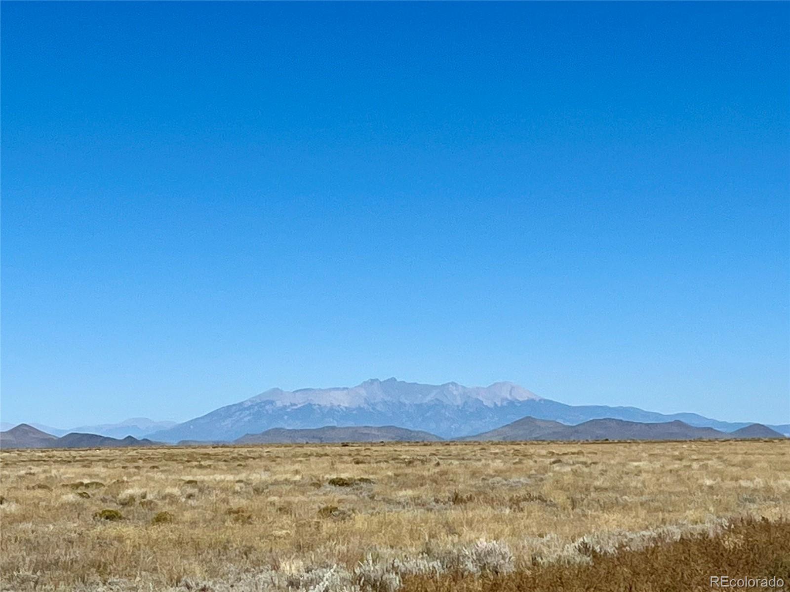 a view of a large body of water and mountain