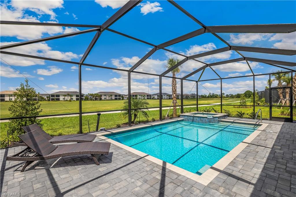 a view of a backyard with sitting area