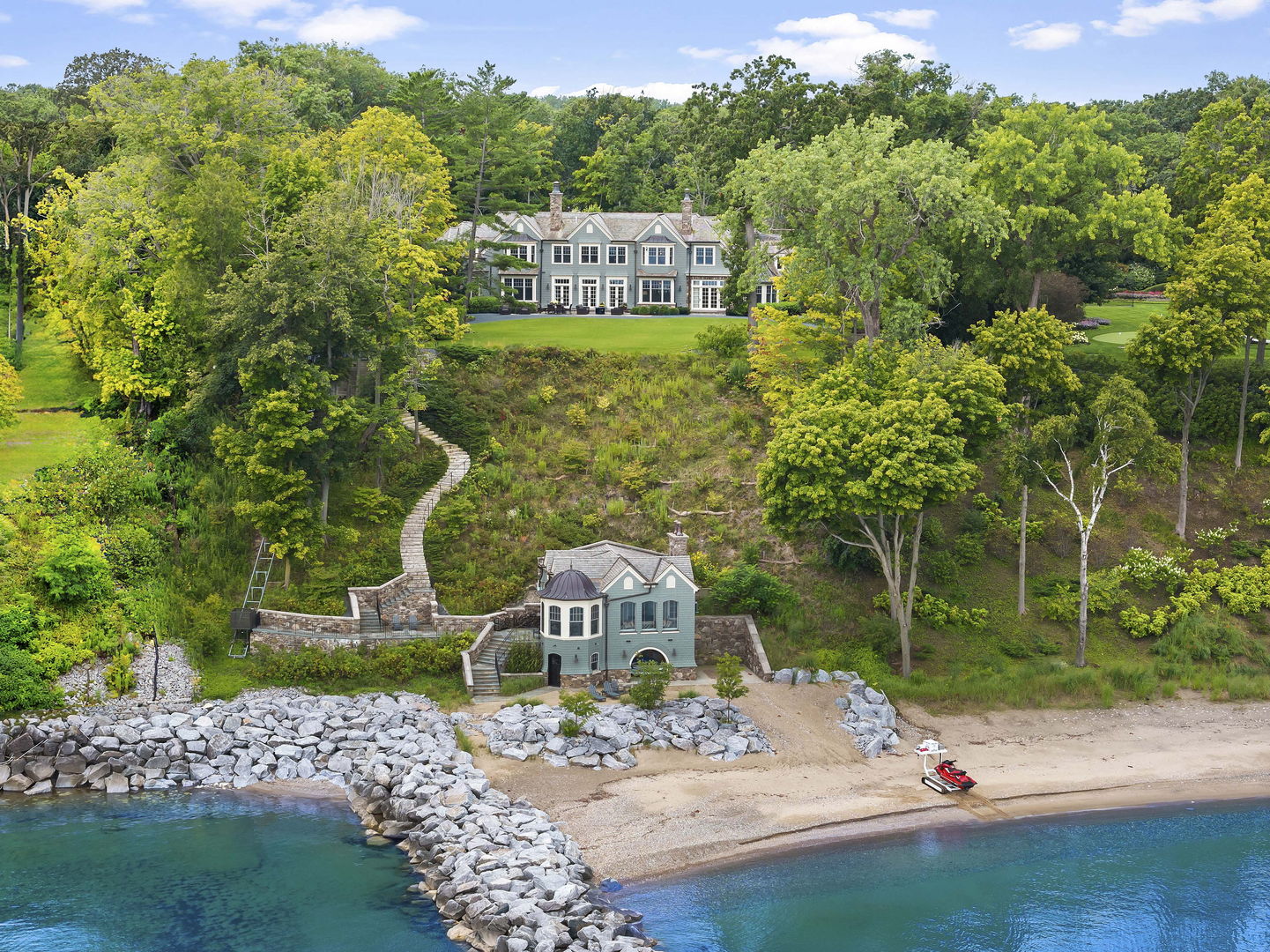 an aerial view of a house with a yard