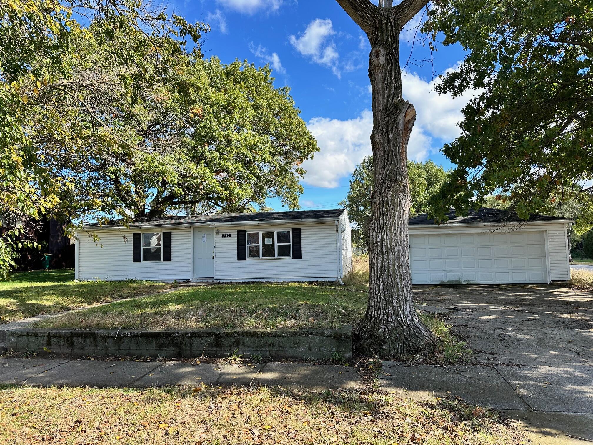 a view of a house with a yard