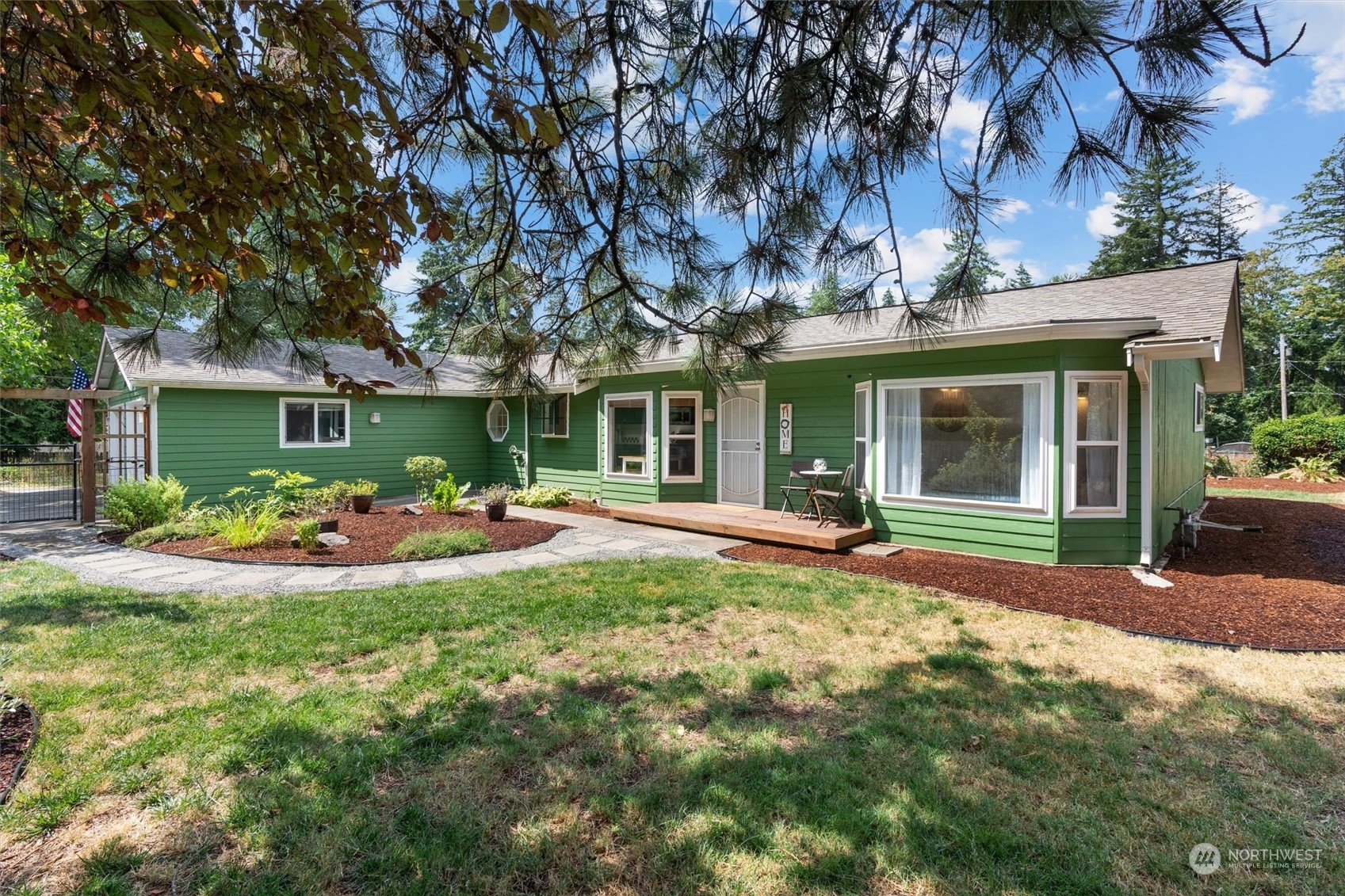 a view of a house with patio and garden