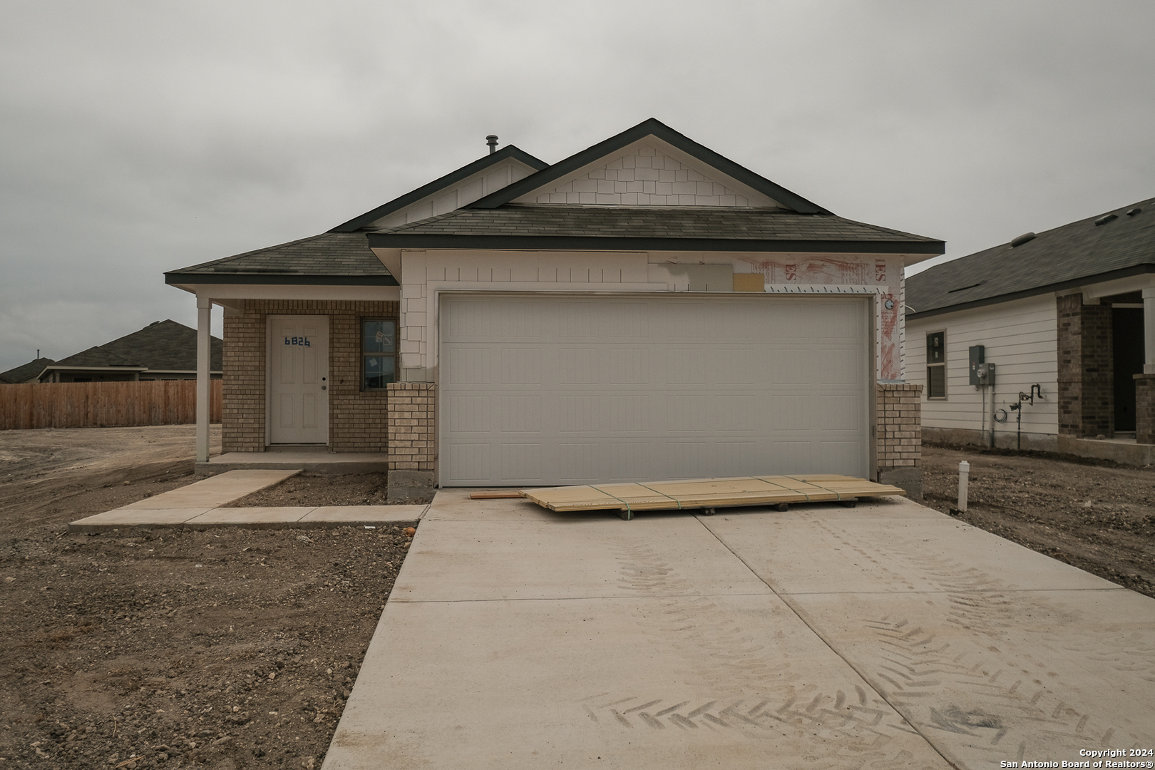 a front view of a house with yard