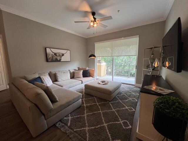 a living room with furniture a flat screen tv and a large window