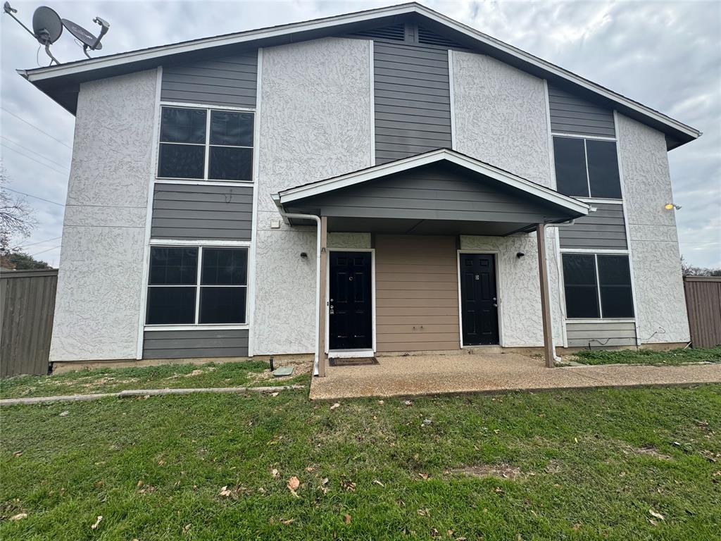 a house with yard in front of it