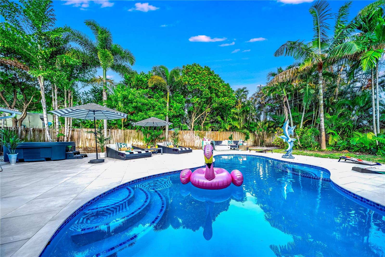 a view of a swimming pool with a patio