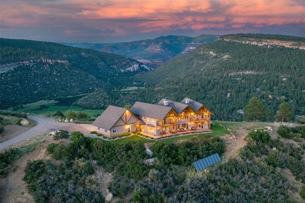 an aerial view of a house with a garden