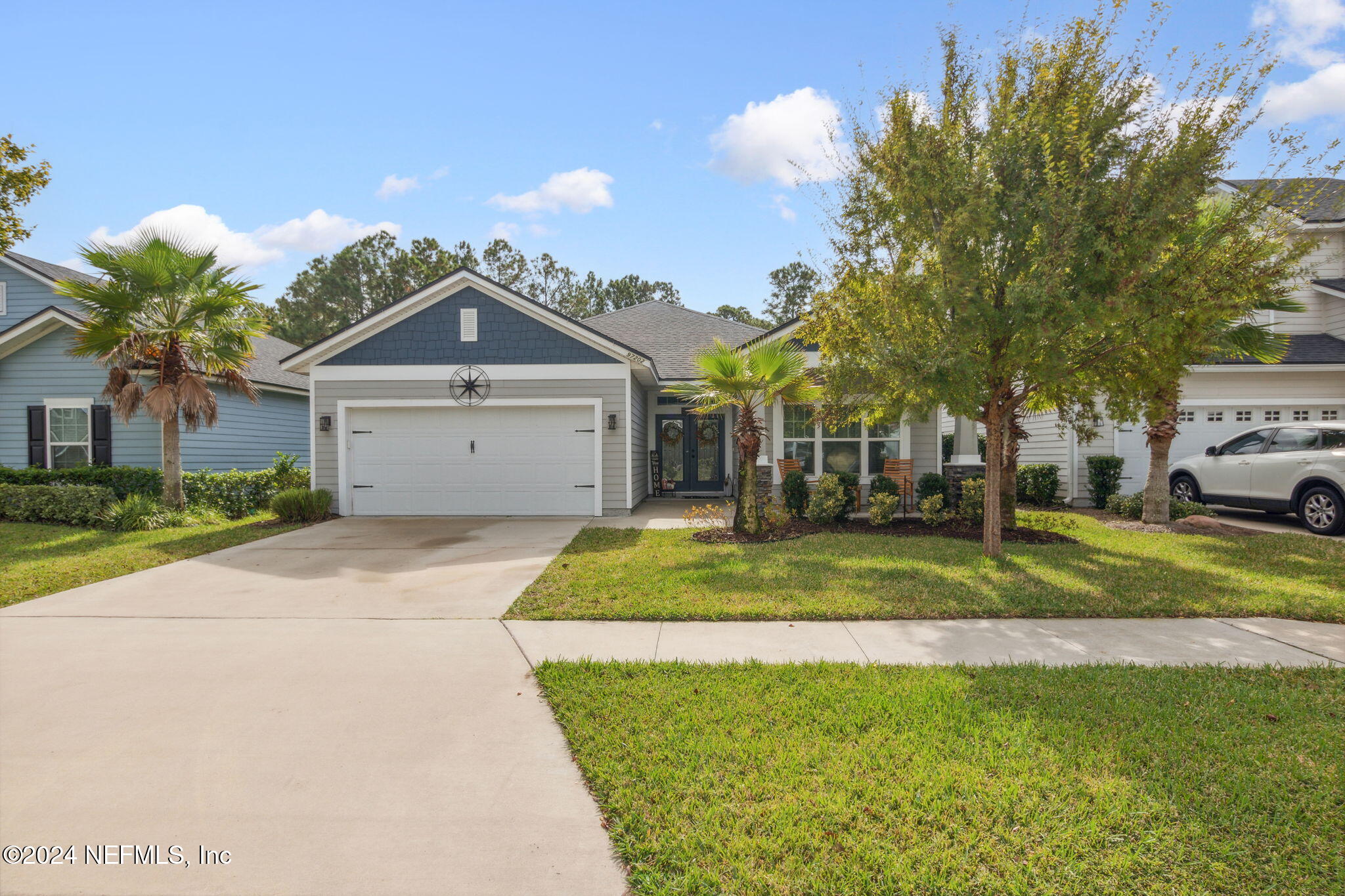 a front view of a house with a yard