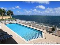 a view of a swimming pool with an outdoor seating