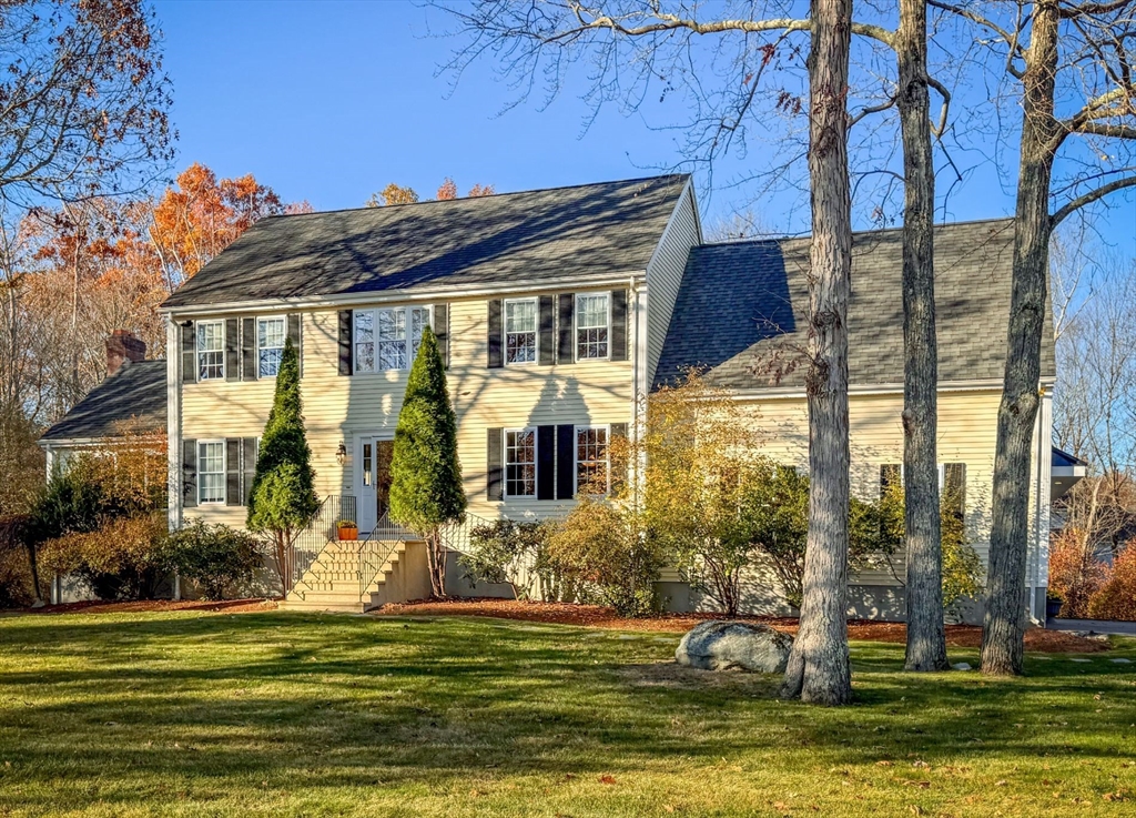 a front view of a house with a swimming pool