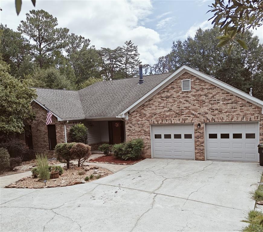 a front view of a house with yard