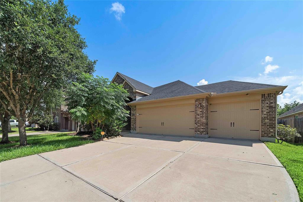 WELCOME TO 21602 MASONWOOD LANE FEATURING 4 BEDROOMS & 3 BATHS WITH A DOUBLE-WIDE DRIVEWAY LEADING TO A 2-CAR GARAGE.