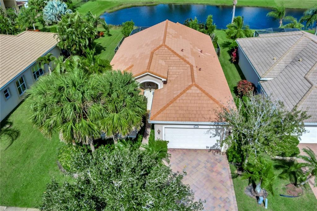 an aerial view of a house with a yard and garden