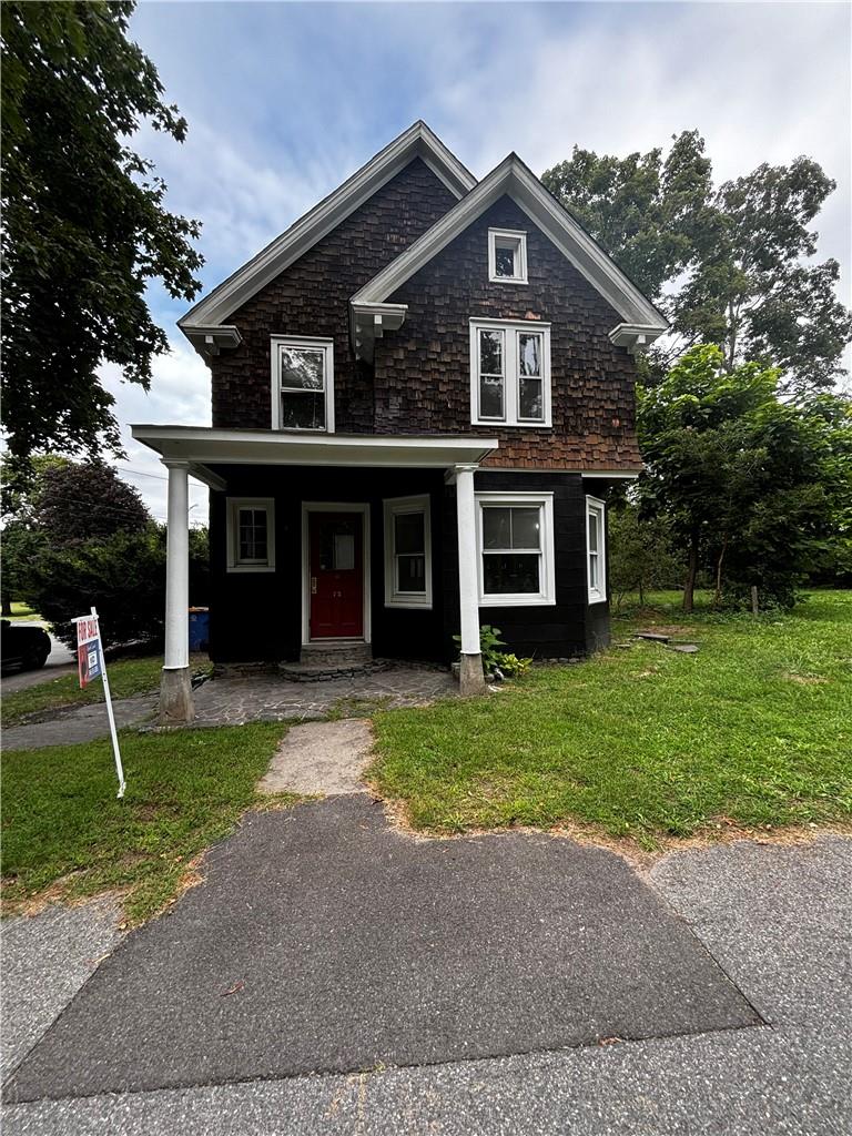 a front view of a house with a yard